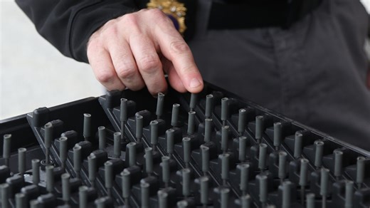 Police demonstration lays out spike strip to stop moving 'stolen' car