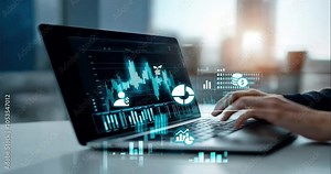 Person on laptop creating and displaying upward trending data visualizations graphs and charts, financial literacy, loans planning, financial coaching