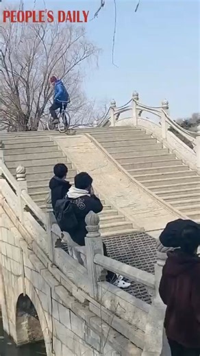 The king of bike tricks! A Chinese grandpa shows off his bike skills at a park. (Please do not imitate!) | People's Daily, China