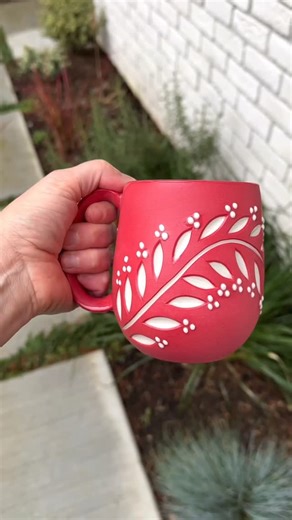 Jennifer Spring on Instagram: "I finally have a finished red mug to share! 🔴✨ After my last post, so many of you had thoughts about the “giant not-actually-red” mug I was carving, so I’m happy to say: here it is in its full, finished glory. In this post I’m also diving a little deeper into how I make my handles—because to me, a handle is one of the most important parts of the mug experience. The balance, the weight, the curve, the way it fits your hand… it all matters. I’ll admit it: I’m a litt