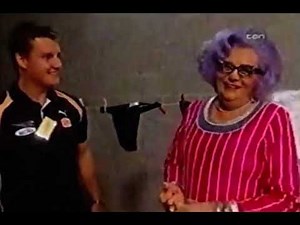 Dame Edna mans the AFL barbecue