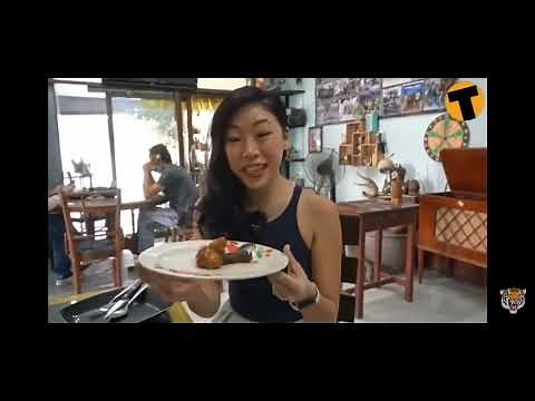 Woman eating cooked penis and balls