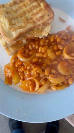 Eggy bread with fried onions garlic and beans with mix powder fusion
