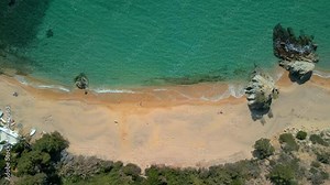 Explore the beauty of Lloret De Mar and the tranquility of Cala Canyelles from a bird's-eye view, amidst the stunning scenery of Costa Brava. cenital view
