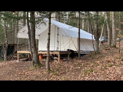 Initial camp area build with canvas tent, deep in the remote wilderness.