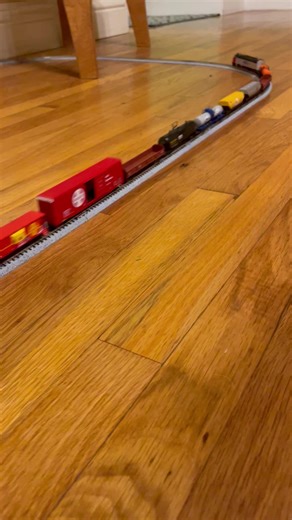 N scale Amtrak train pulling freight . 🛎️🛎️🛎️