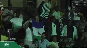 Behind the Lesotho national flag we proudly. recognise and appreciate VUT. We were welcoming our female choir on stage. | The Lesotho Chorus