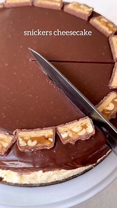 The ultimate snickers cheesecake, perfect for the holidays! It’s perfectly creamy and so easy to make! You can find the full recipe on my website www.goldengracekitchen.com and search Hershey’s ganache cheesecake or you can Google Golden Grace kitchen Hershey’s ganache cheesecake #cheesecake #snickerscheesecake #ganachecheesecake #christmasdesserts #cskes | The Golden Grace Kitchen