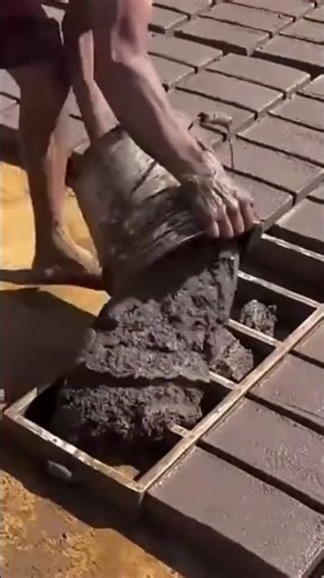 A clay that is being neatly molded by a man using a special mold