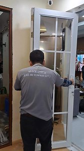 french type bifold door in powdercoated white finish and 6mm reflective bronze glass #installed #thankyou | MGV Glass And Aluminum Supply