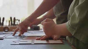 clip-3706198331-tilt-up-shot-young-person-down-syndrome-taking