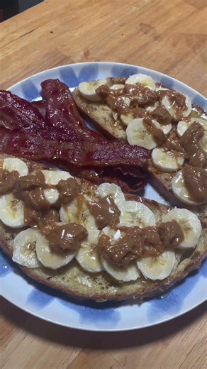Smoked bacon with homemade French toast, covered in bananas, peanut butter and maple syrup #food