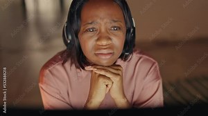 Call center agent woman on video call, getting frustrated, upset and sad in a work meeting. Female worker shocked, confused and unhappy while working online and remote in her home with laptop