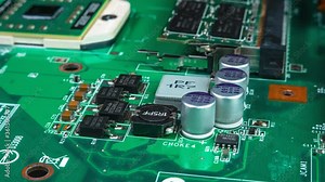 Circuit board background of PC computer motherboard. Computer circuit board close up, electronic technology background