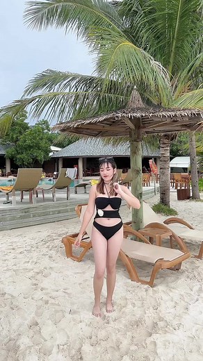 Leisurely Beach Walk in Stylish Swimwear