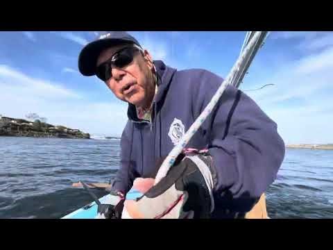 Tacking a sailboat with a tiller extension