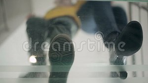 View on the Soles through the Glass Floor Stock Video - Video of human, light: 73374229