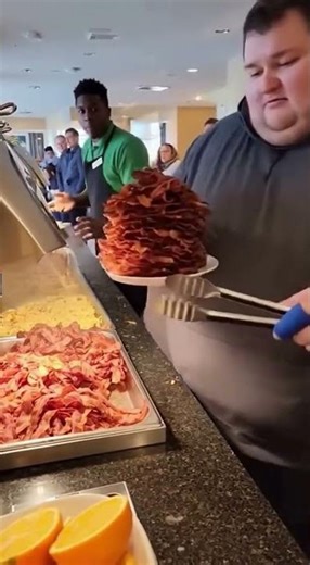 Man takes all the bacon at continental breakfast buffet!￼