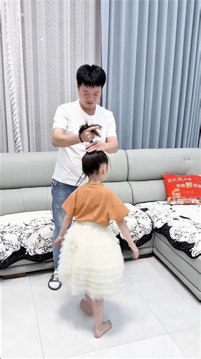 The girl's dad styled her hair in a genius way.
