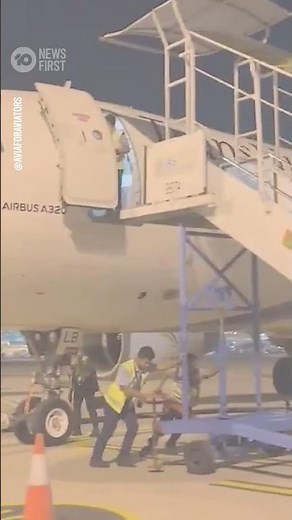 Airport Worker Falls From Plane at Airport in Indonesia | 10 News First