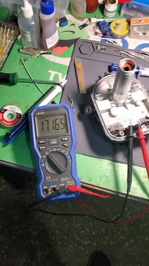 Close-Up Repair of Electronic Device on Workbench