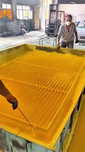 Industrial Powder Coating Process for Large Metal Grids in a Manufacturing Factory