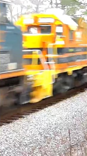 CSX manifest train with 3 CN units and a switcher and a SD70MAC