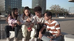 Group of happy teenager friends using their mobile phones to share funny moments on social media