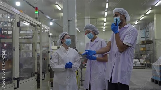Collaboration in pharmaceutical lab industrial facility team meeting clean environment professional viewpoint innovation discussion