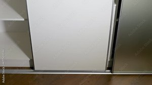 Stop motion animation Furniture.The system of sliding doors in the wardrobe, the system of opening and closing sliding doors of the compartment. Storage space for clothes. Doors on aluminum rails.
