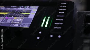 Audio mixer Change the volume level. Sound engineer adjusts the sound. Remote control for adjusting the sound. Music Festival. Recording studio. Sound mixing console for managing audio tracks