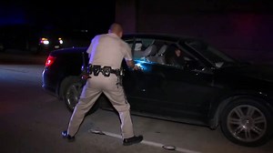 CHP officer rescues woman passed out in moving car