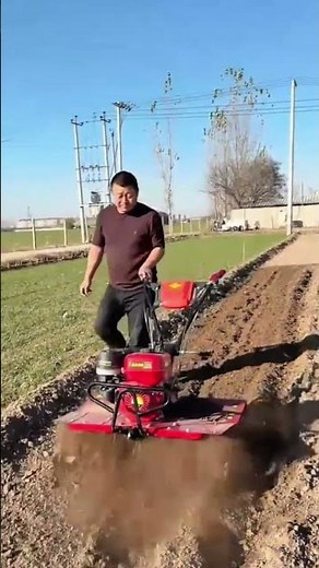 Tilling garden soil effortlessly using a powerful gas-powered rotary tiller machine