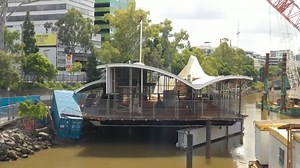 Works begin to remove flood-damaged restaurant from Brisbane sidewalk