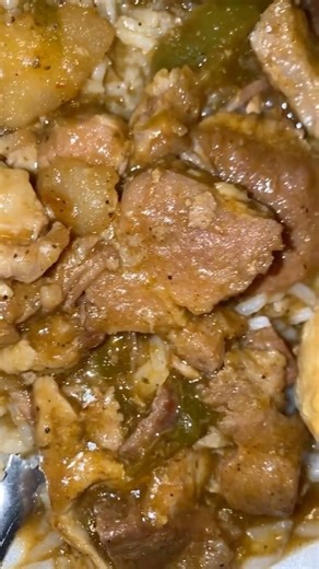 smothered pork, chops, and gravy and rice with peppers and corn and biscuit ￼🥰💦