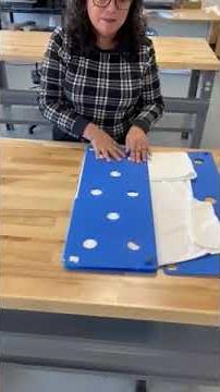How to fold a shirt using a folding board
