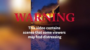 Carriages burn following deadly Russian drone attack on Ukraine passenger train