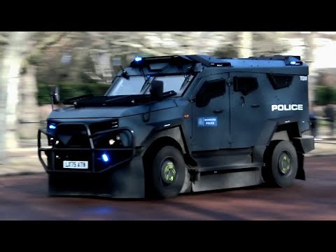 Metropolitan Police's new armed SandCat trucks responding with blues and sirens.