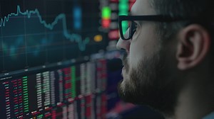 Man analyzing the stock market in real time  - Free Stock Video