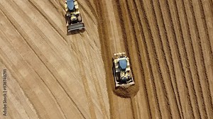 construction work of two bulldozers during road construction. Large bulldozers level the sandy base. Epic footage of large construction equipment working. drone view of road construction.
