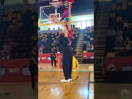 Jordan Kilganon dunks over Shaquille O'Neal