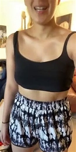 Clingy Bird Pops Out of Black Tank Top