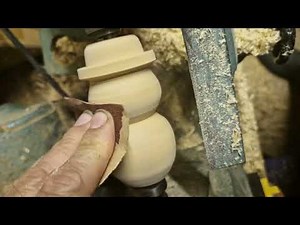Wood turning a snowman ornament