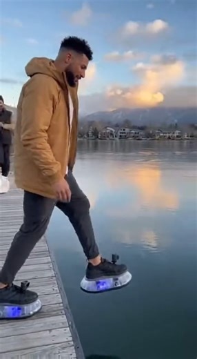 Man Appears to Walk on Water Using Floating Shoes in Surreal Lake StuntUnspecified Location