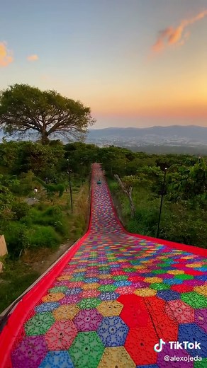 Rainbow tube slide in El Salvador 🤯🇸🇻 Would you slide down? #elsalvador #travel #slide