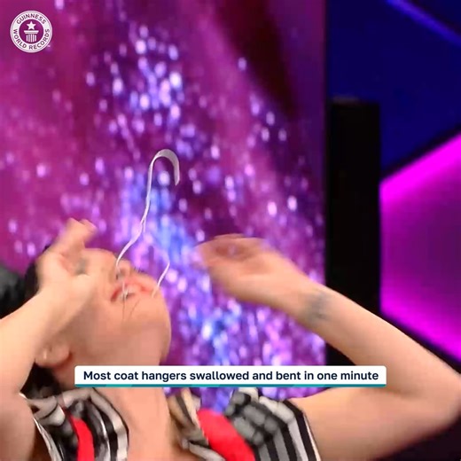 The most coat hangers swallowed and bent in one minute is 14 🤯 | Guinness World Records