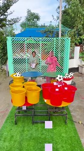 1.7M views · 8K reactions | thrilling water bucket ball challenge : village women skillfully drop balls into rotating buckets | SS Food Challenge | Facebook