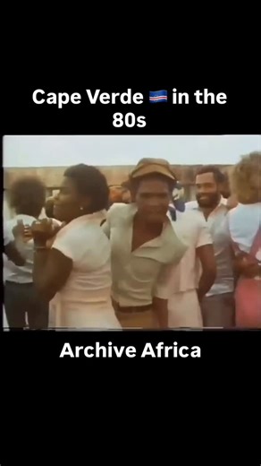 Cabo Verde Travel - Travel In Cape Verde - CVEI on Instagram: "Archival footage of Cape Verde 🇨🇻 in the 80s. In the early 80s dance in Cape Verde was more than celebration it was identity. Funana is a fast high energy musical and dance style from Santiago in Cape Verde driven by accordion and ferrinho rhythms and once suppressed during colonial rule. Funana once restricted during colonial rule burst into public life after independence carrying an urgent accordion driven energy from the rural h