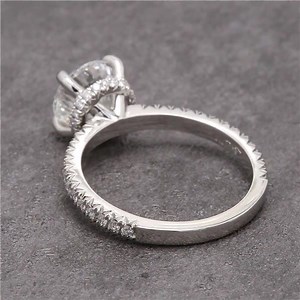 This luxurious hidden halo ring features a bright Scintillion™ lab diamond center. Hidden halos are a lovely way to bring brightness to the gallery of an engagement ring! #LabDiamond #DiamondRing #HiddenHalo #EngagementRing #CustomRing #WeddingRing #diamondSolitaire https://www.greenlakejewelry.com/gallery/gallery_detail.aspx?Imgid=178053 | Green Lake Jewelry Works