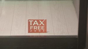 Download Tax free zone sign in retail establishment window for free
